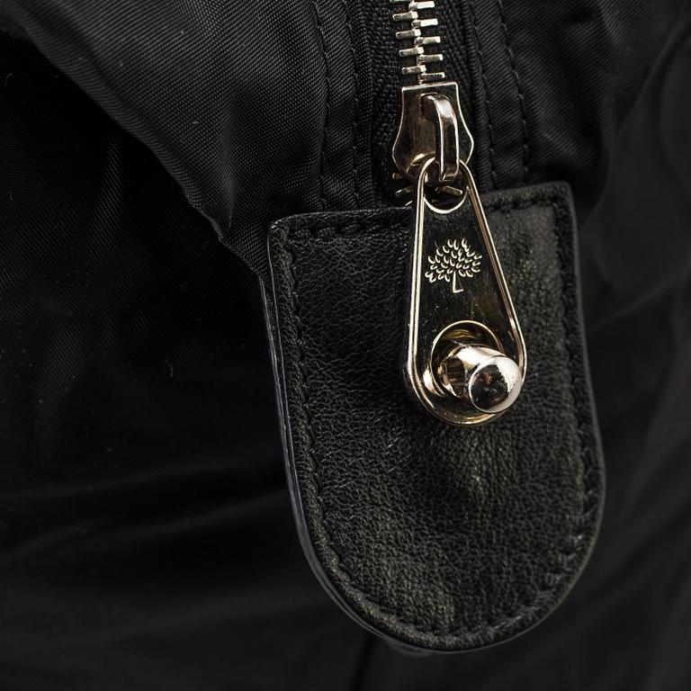 A foldable Mulberry weekend bag.