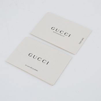 Gucci, clutch.