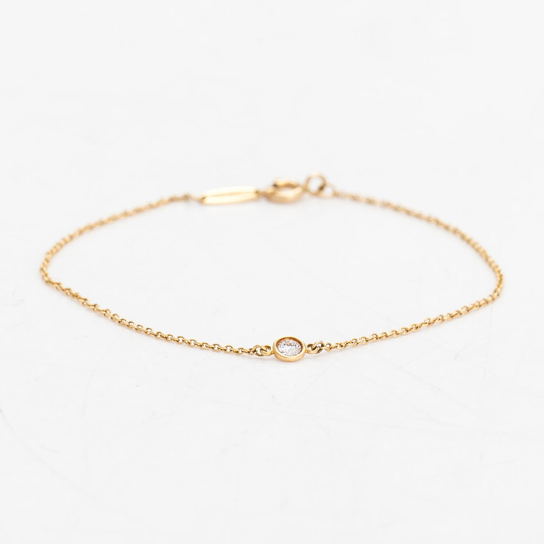 Tiffany & Co, Elsa Peretti, armband, "Diamonds by the Yard", 18K guld med en diamant ca 0.08 ct.