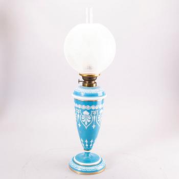 A glass paraffin lamp around 1900.