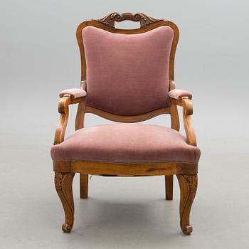 A neo rococo open armchair from around the 1860s.