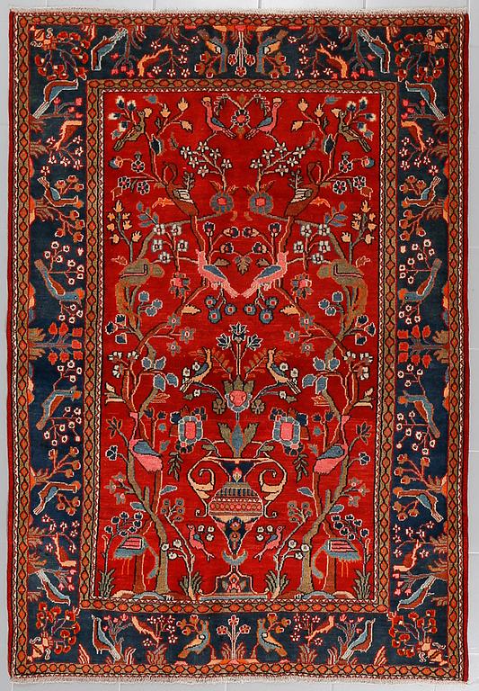 AN OLD/SEMI ANTIQUE ARAN RUG, 194 x 130 cm.