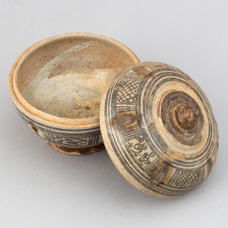 A Sawankhalok jar with cover and a pale celadon glazed bowl for the South East Asian market.