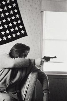 Larry Clark, "Untitled (man, flag, gun)", 1971.