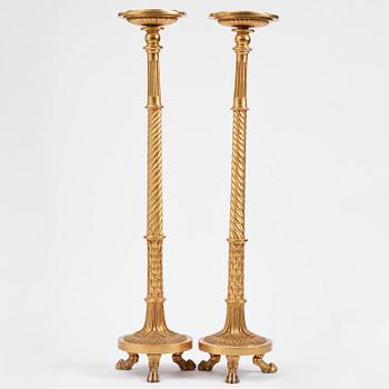A pair of late Gustavian giltwood torchères by J. Frisk (master in Stockholm 1805-24).