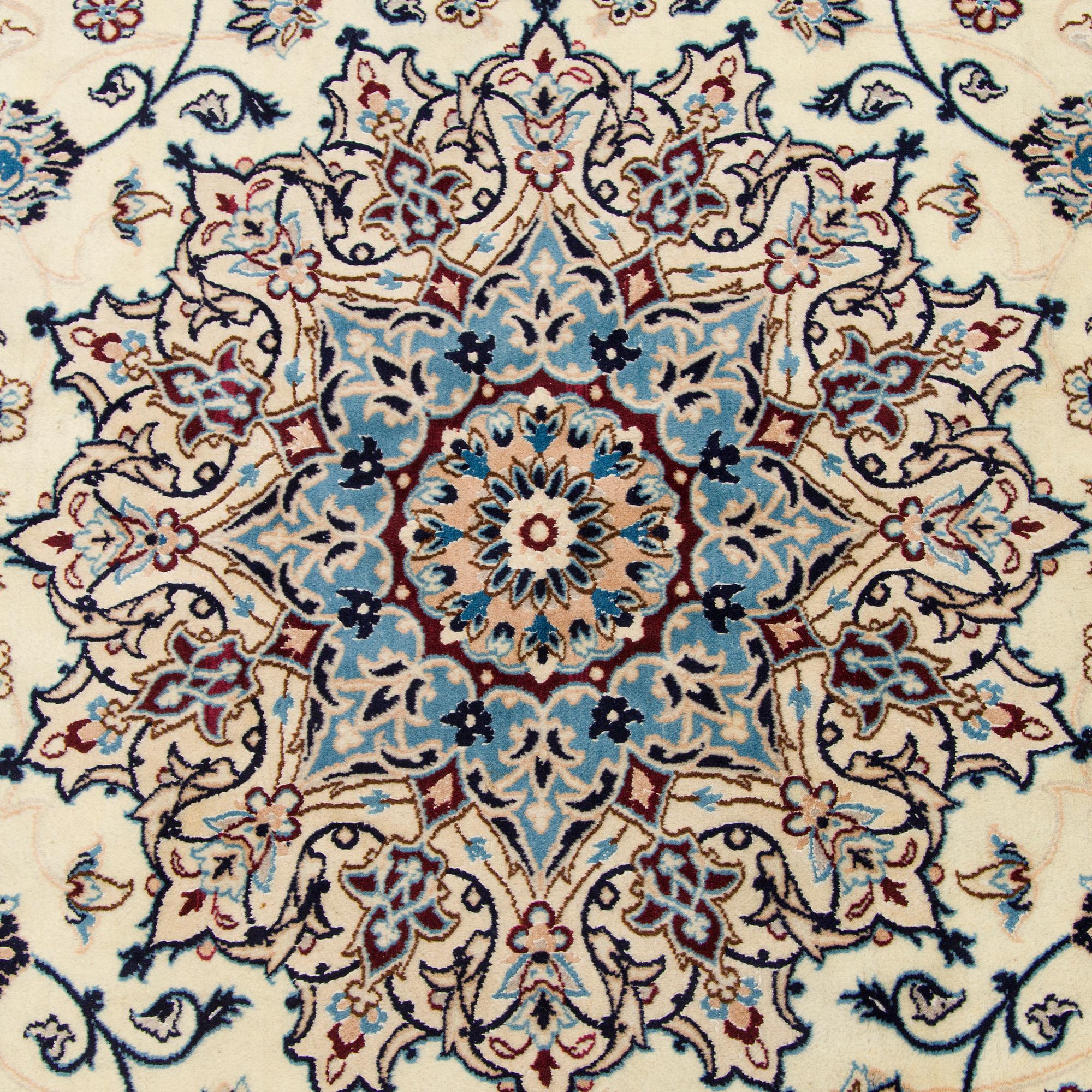 A carpet, Nain, part silk S.K 9LAA. Circa 352x248 cm.