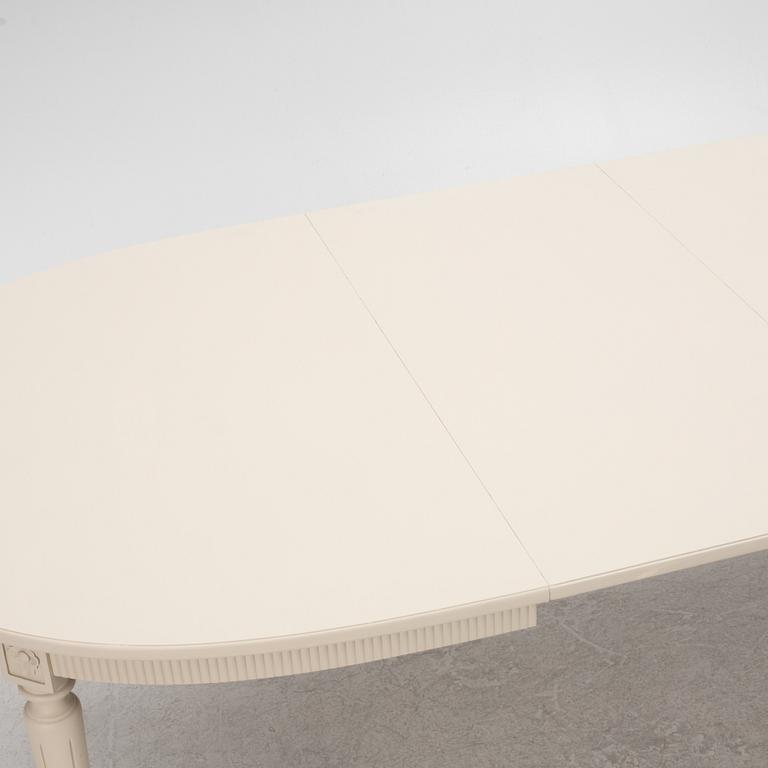 A Gustavian Style Dining Table and 10 Chairs, second half of the 20th Century.