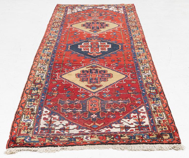 A Northwest Persian runner, c 330 x 97 cm.