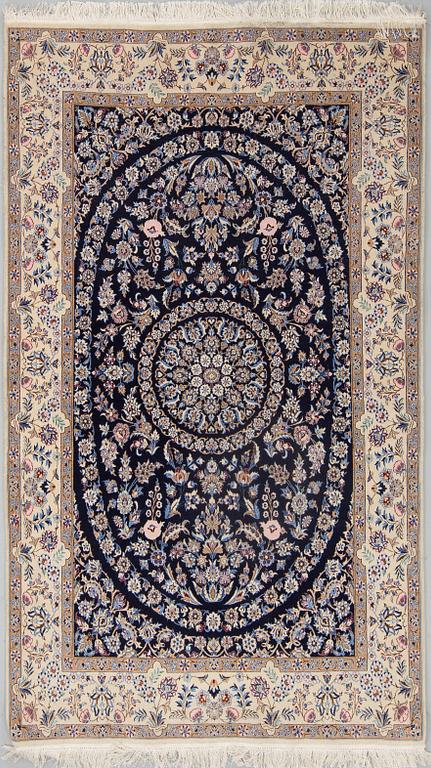 A part silk rug from Nain, around 218 x 126 cm.