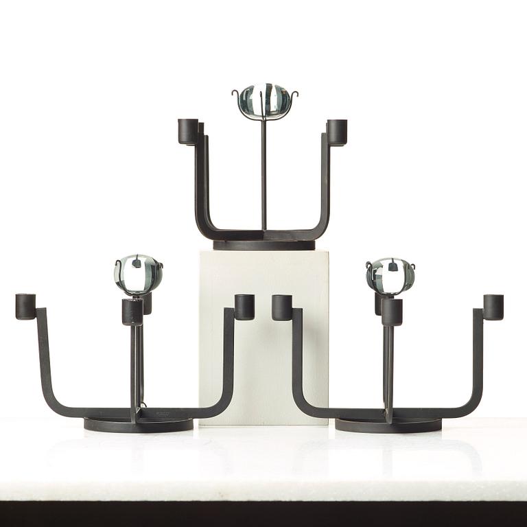 Gunnar Ander, a set of three iron and glass candlesticks for Ystad Metall, Sweden, mid 20th century.