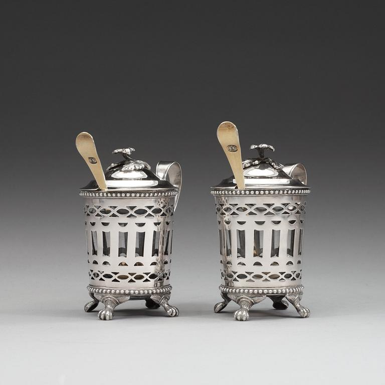 A pair of Swedish 18th century silver mustard-pots and spoons, makers mark of Simson Ryberg, Stockholm 1794.