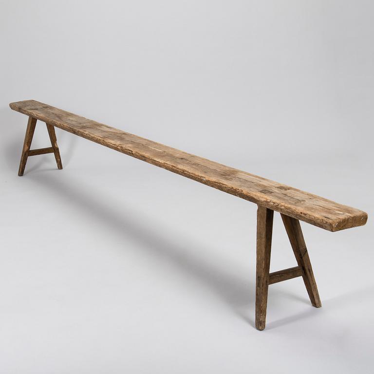A folk art bench, circa 1900.