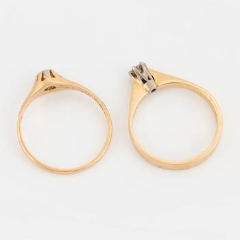 Two rings set with round, brilliant-cut diamonds, 18K gold and white gold.