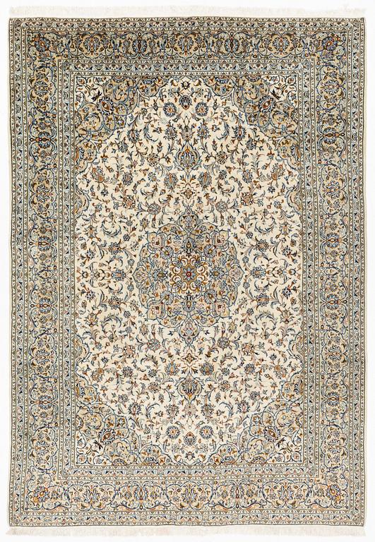 A Keschan carpet, signed, c. 350 x 245 cm.