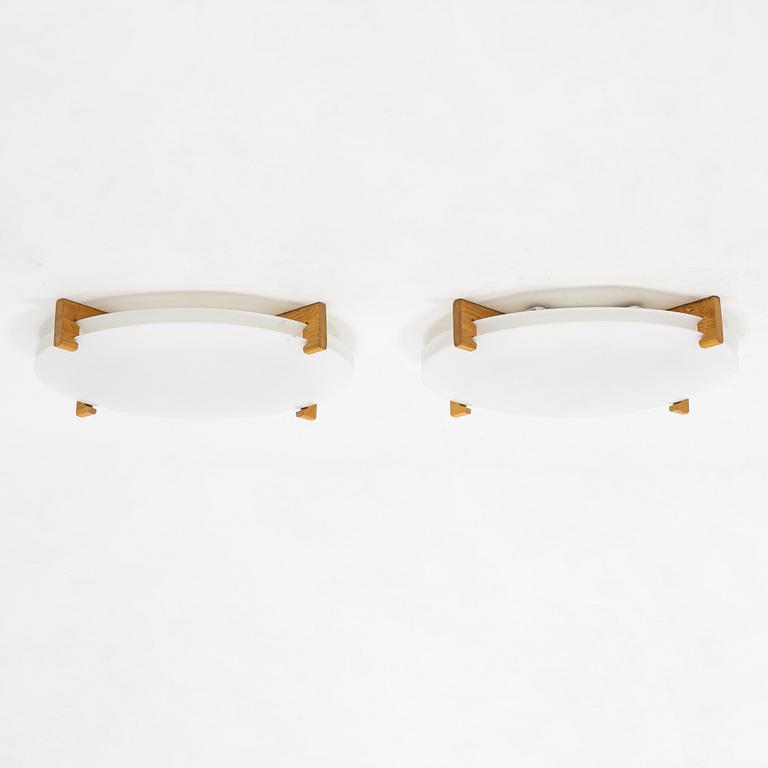 Uno & Östen Kristiansson, a pair of 'Plafo' plastic and oak ceiling lights, Luxus, Vittsjö.