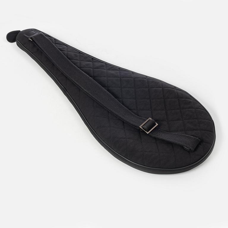 Chanel, tennis racket and 4 balls with case.