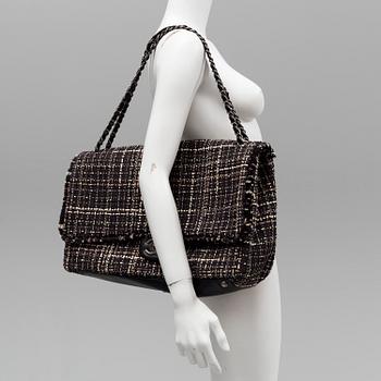 A tweed bag "Classic flip bag XL" by Chanel from 2016-2017.