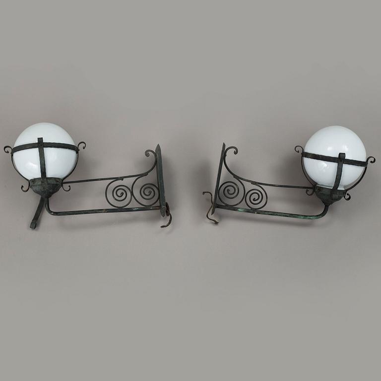 A pair of 1920's copper and glass outdoors wall lights.