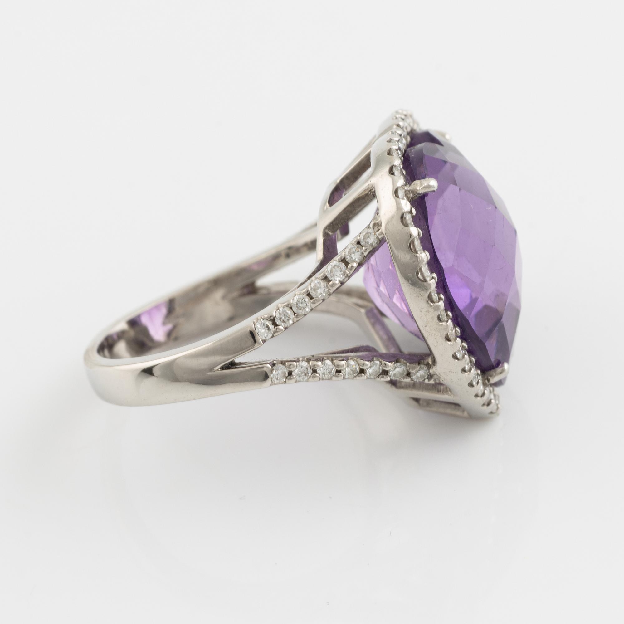 Heart shaped amethyst and brilliant cut diamond ring.