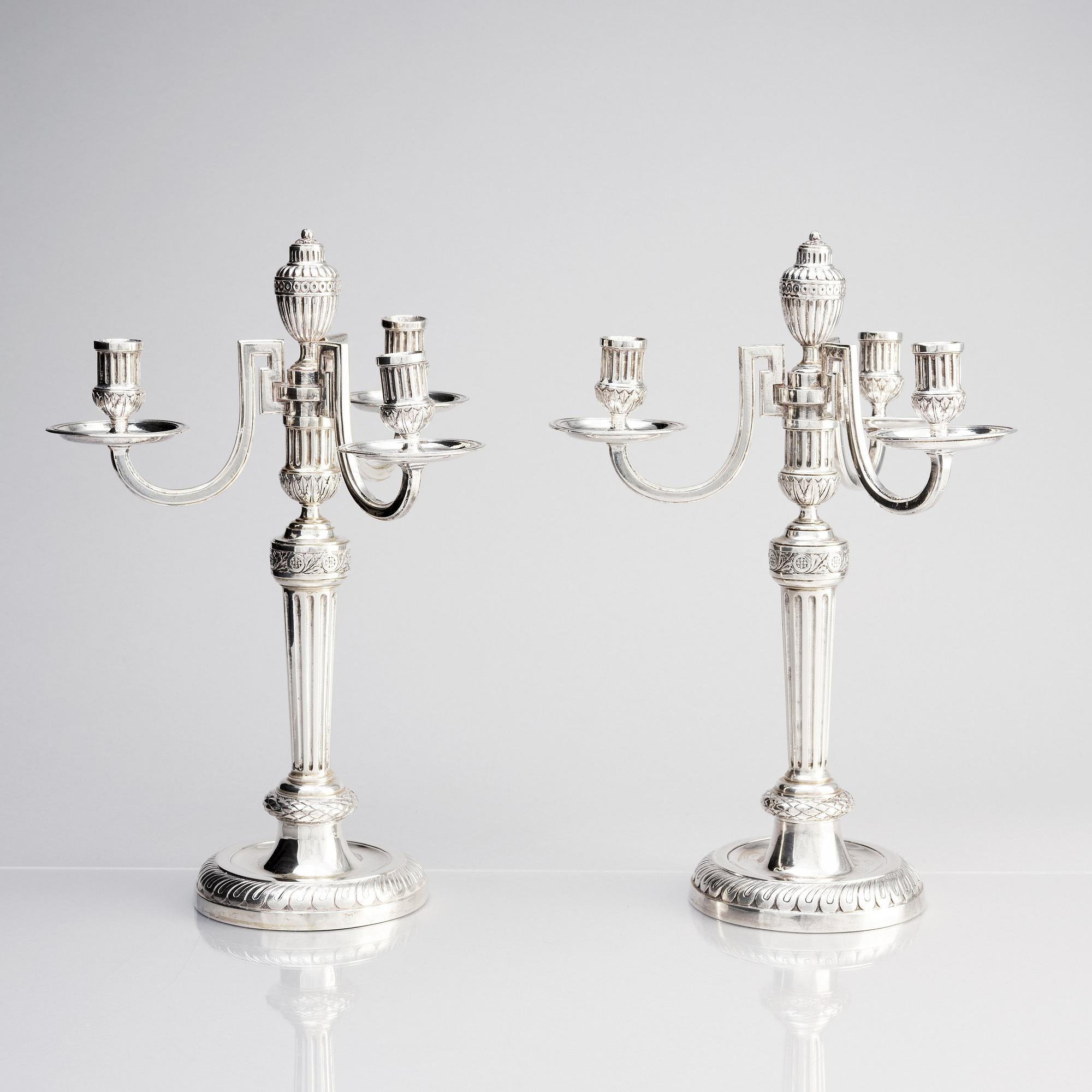 A pair of Austrian Royal, Three-armed silver candelabras, marks of lgnaz Joseph Würth, Vienna 1779.