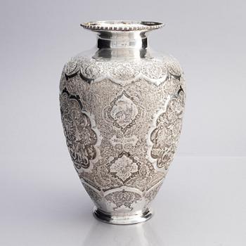 A Persian silver vase, late Qajar dynasty around 1910.