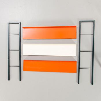A 1950s  Adriaan Dekker lacquered metal book shelf for Tomato Holland.