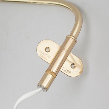 A wall lamp by JOSEF FRANK, model nr 2226, Firma Svenskt Tenn.