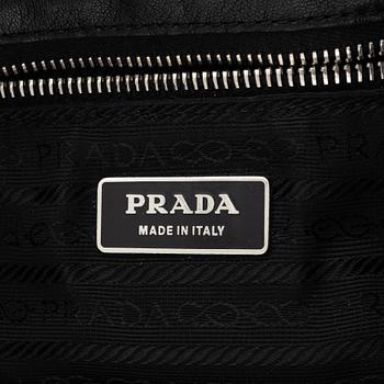 Prada, A black leather bag.