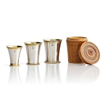 276. Three Swedish 18th century parcel-gilt silver beakers and a case of birch, different maker's.