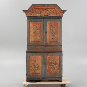 A painted cabinet, dated 1825.