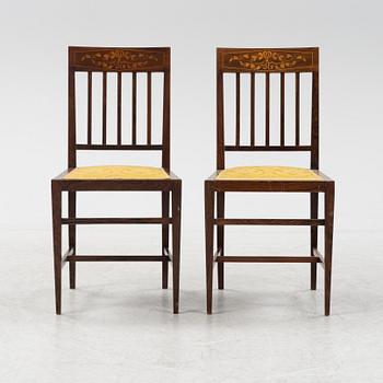 A group of five rosewood veneered chairs and a stool, mid 20th Century.