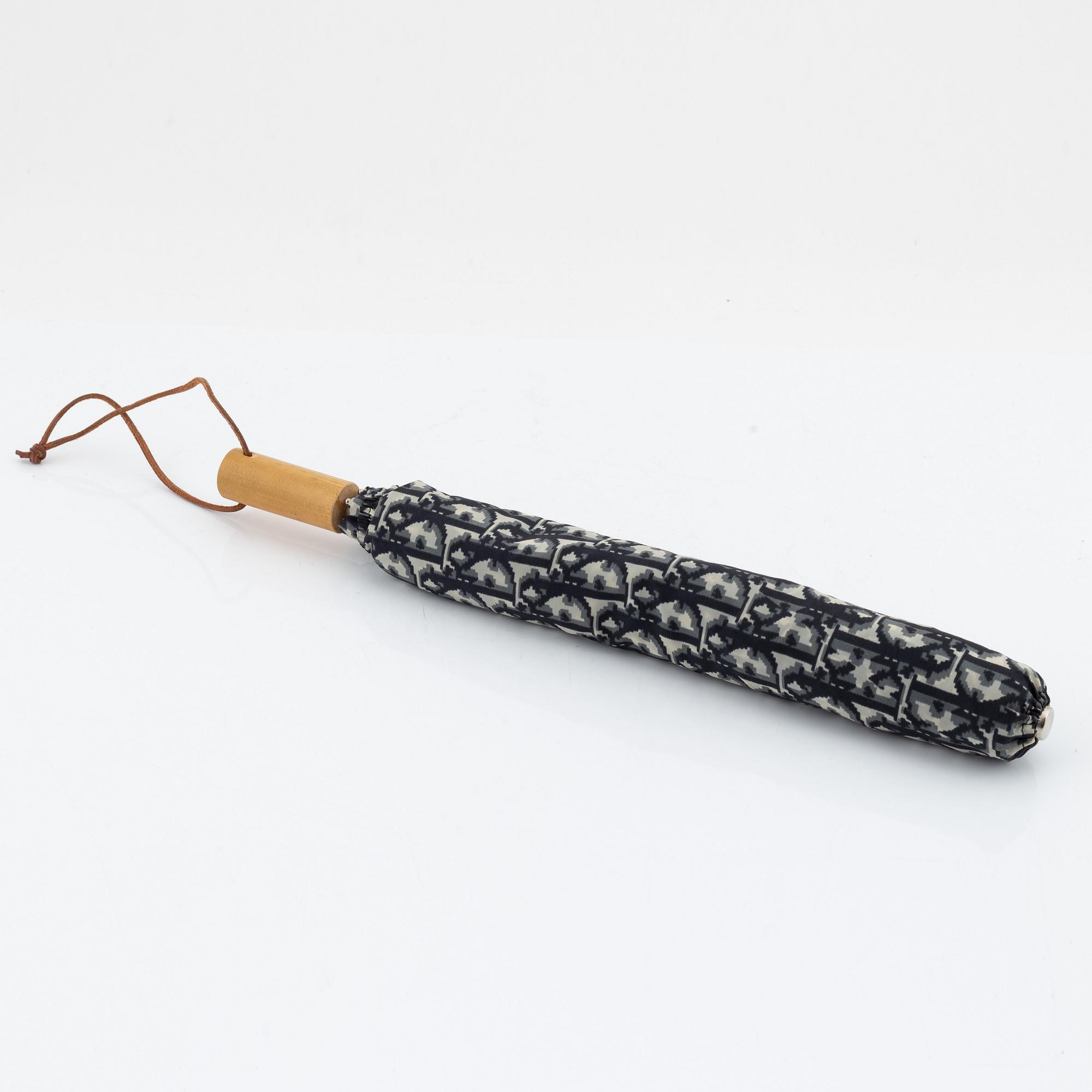 Christian Dior, weekendväska med paraply.