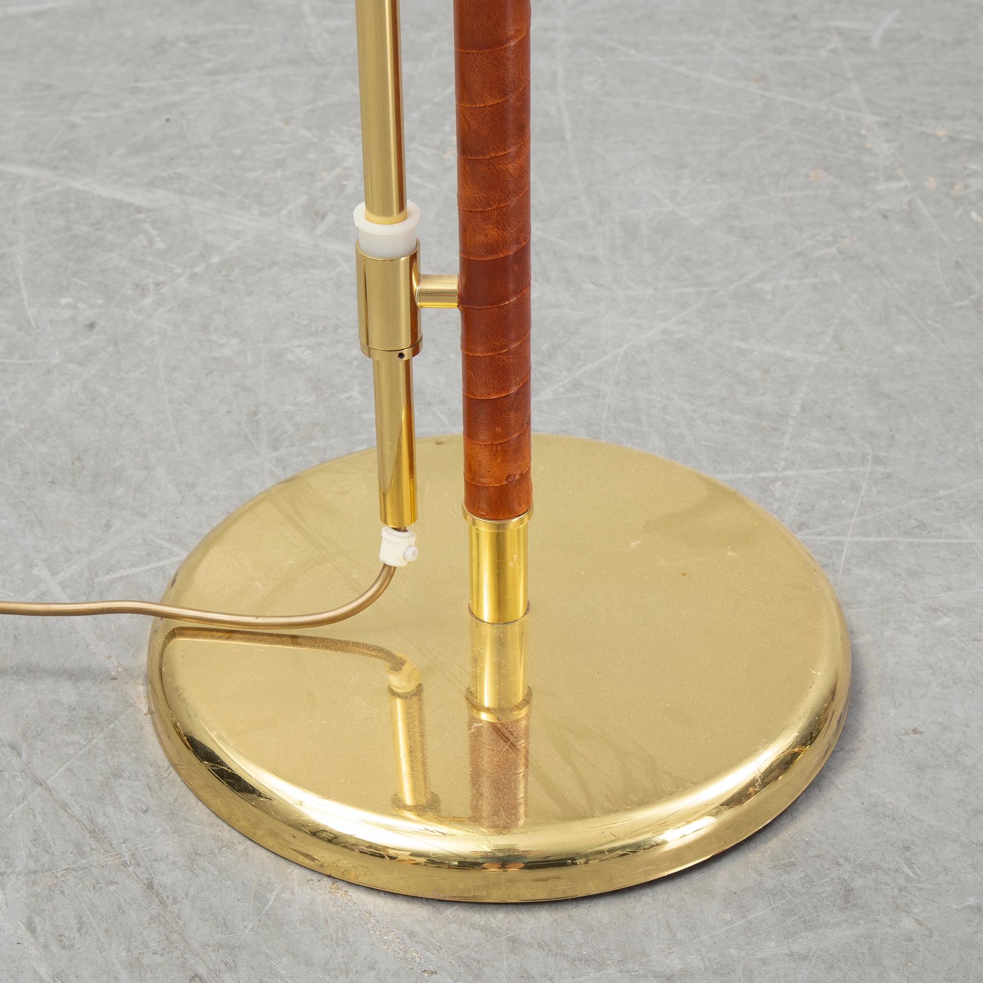 A pair of brass and leather floor lights, Örsjö Industri, 21st century.