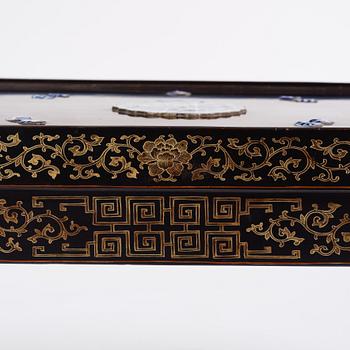 A Chinese black lacquered table with porcelain placques, presumably first half of the 20th century.