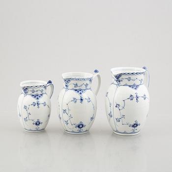 Three 'Blue Fluted Half Lace' / 'Musselmalet' porcelain jugs, Royal Copenhagen, model 562, 561, 763, 1898-1923 and 1962.