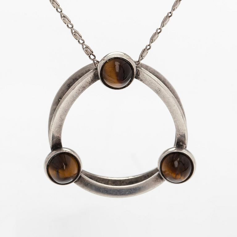 Elis Kauppi, a silver and tiger's eye pendant, Kupittaan Kulta, Turku. With chain in silver.