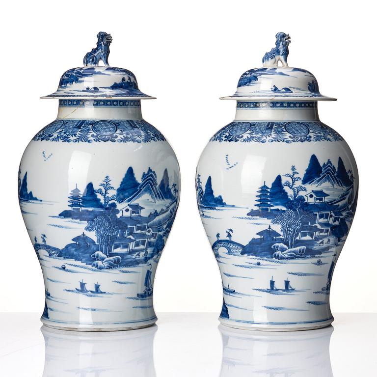 A pair of blue and white Chinese porcelain jars with covers. Qing dynasty, Qianlong (1736-95).