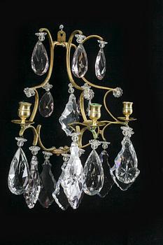 VÄGGLAMPETTER, ett par, rokokostil, omkr år 1900.