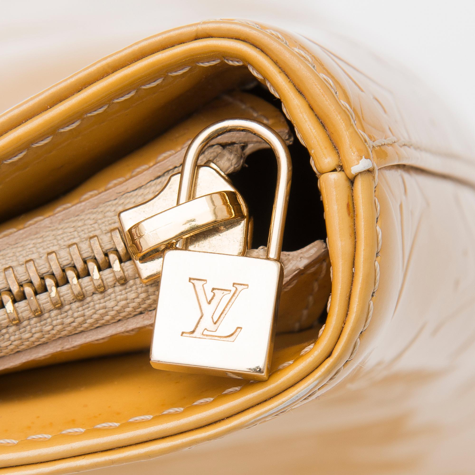 A Monogram Vernis Houston Bag.