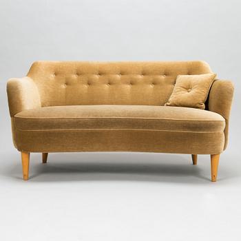 A mid-20th-century sofa and armchair.