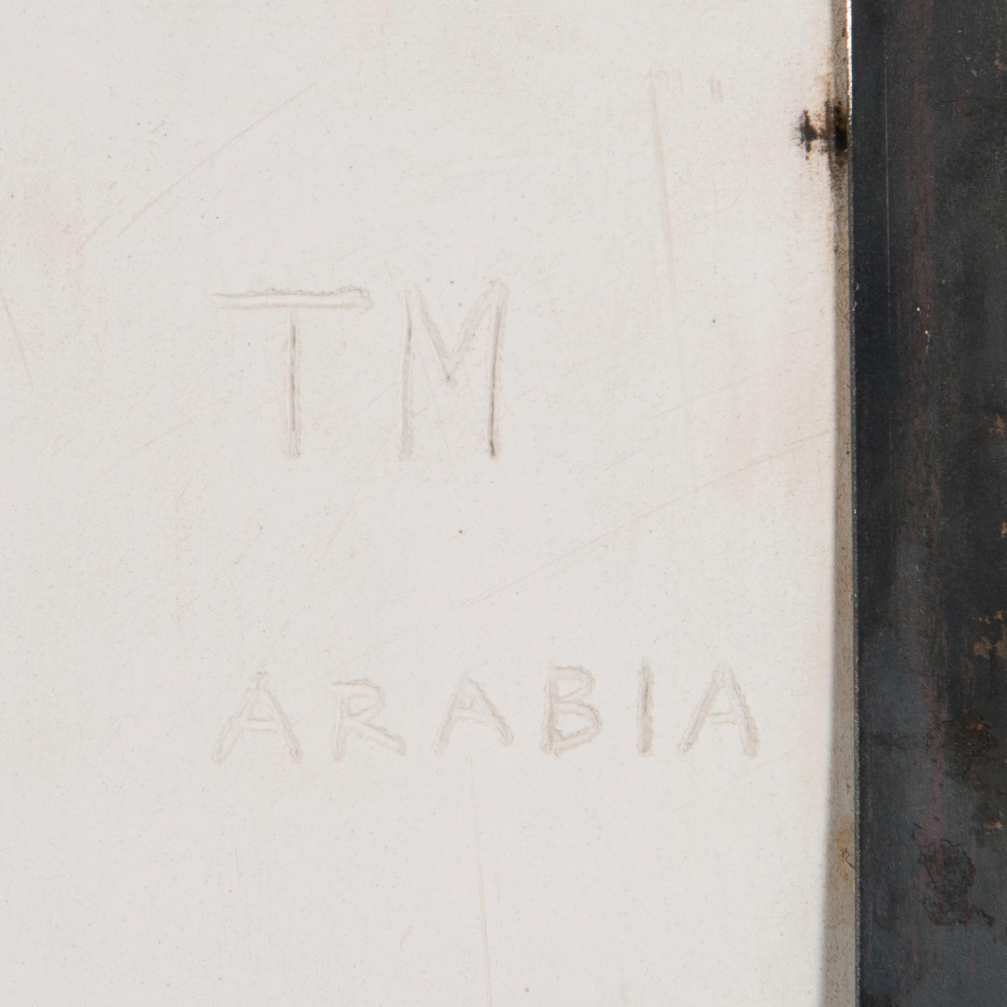 TOINI MUONA, A stoneware relief signed TM Arabia.
