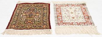 Rugs, two smaller Hereke, silk. 64x44 and 46x43 cm.