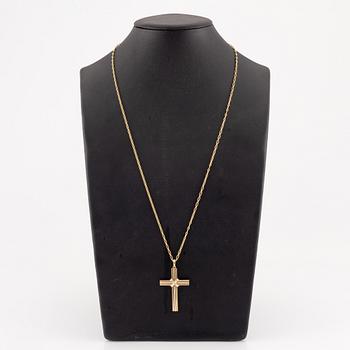 A Cartier necklace 18K multi-coloured gold "Trinity" cross.