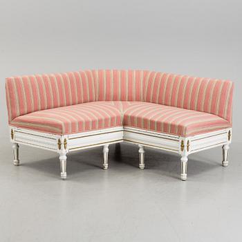 An early 19th century corner sofa.