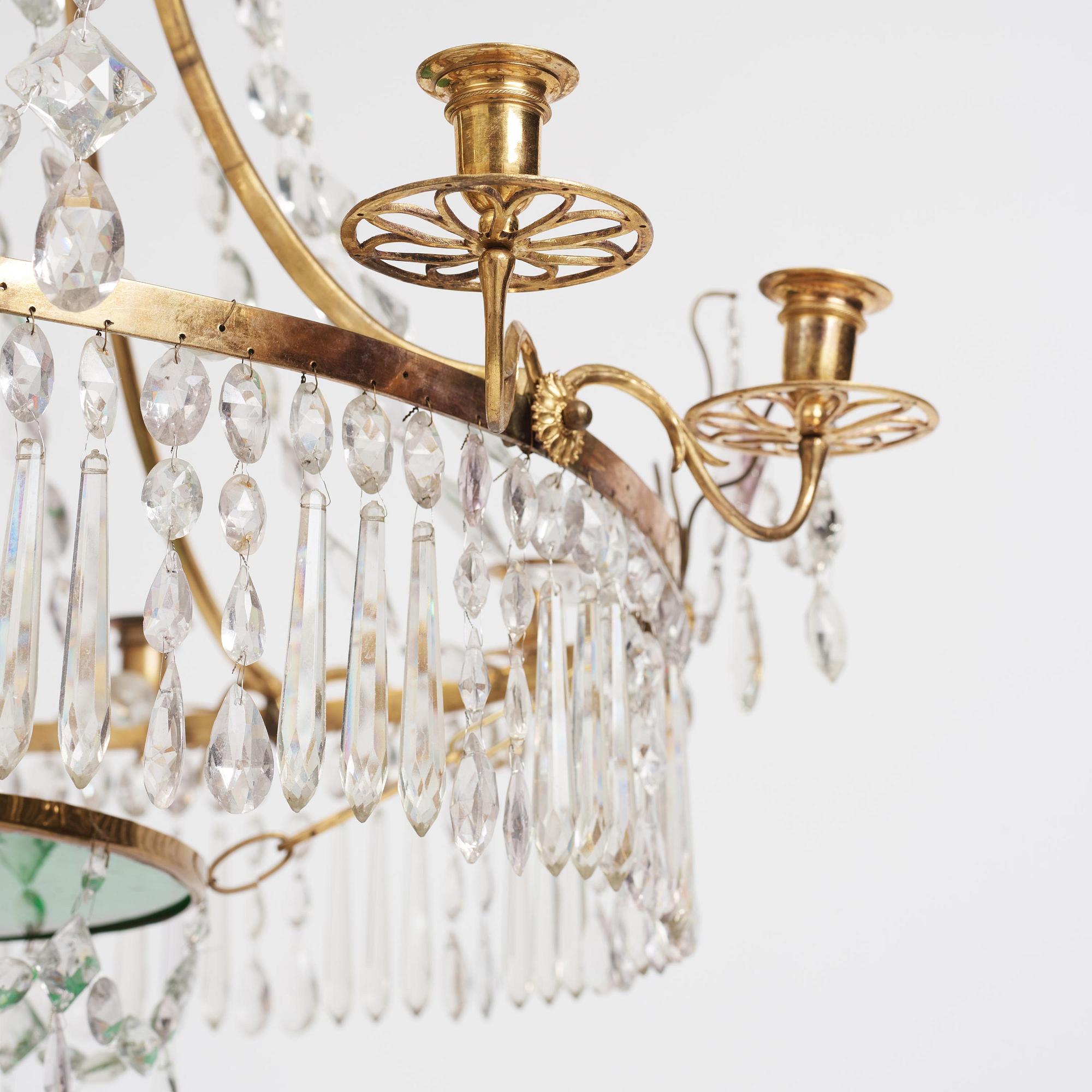 A German Louis XVI ormolu and cut-glass nine-light chandelier attributed to Johann Christoph Ermisch, late 18th century.