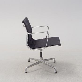 An 'Aluminum group arm chair by Charles & Ray Eames, for Vitra.