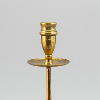 A pair of model 2539 brass candlesticks, for Firma Svenskt Tenn, designed ca 1949-50.