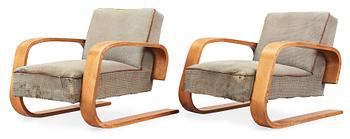 A pair of Alvar Aalto 'no 400' birch armchairs, O.y Huonekalu-ja Rakennustyötehdas A.B for Artek, Finland ca 1939.