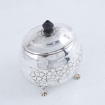 A silver sugar box, early 20th Century.