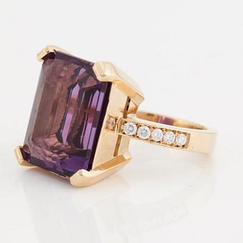 A amethyst and brilliant cut diamond ring.